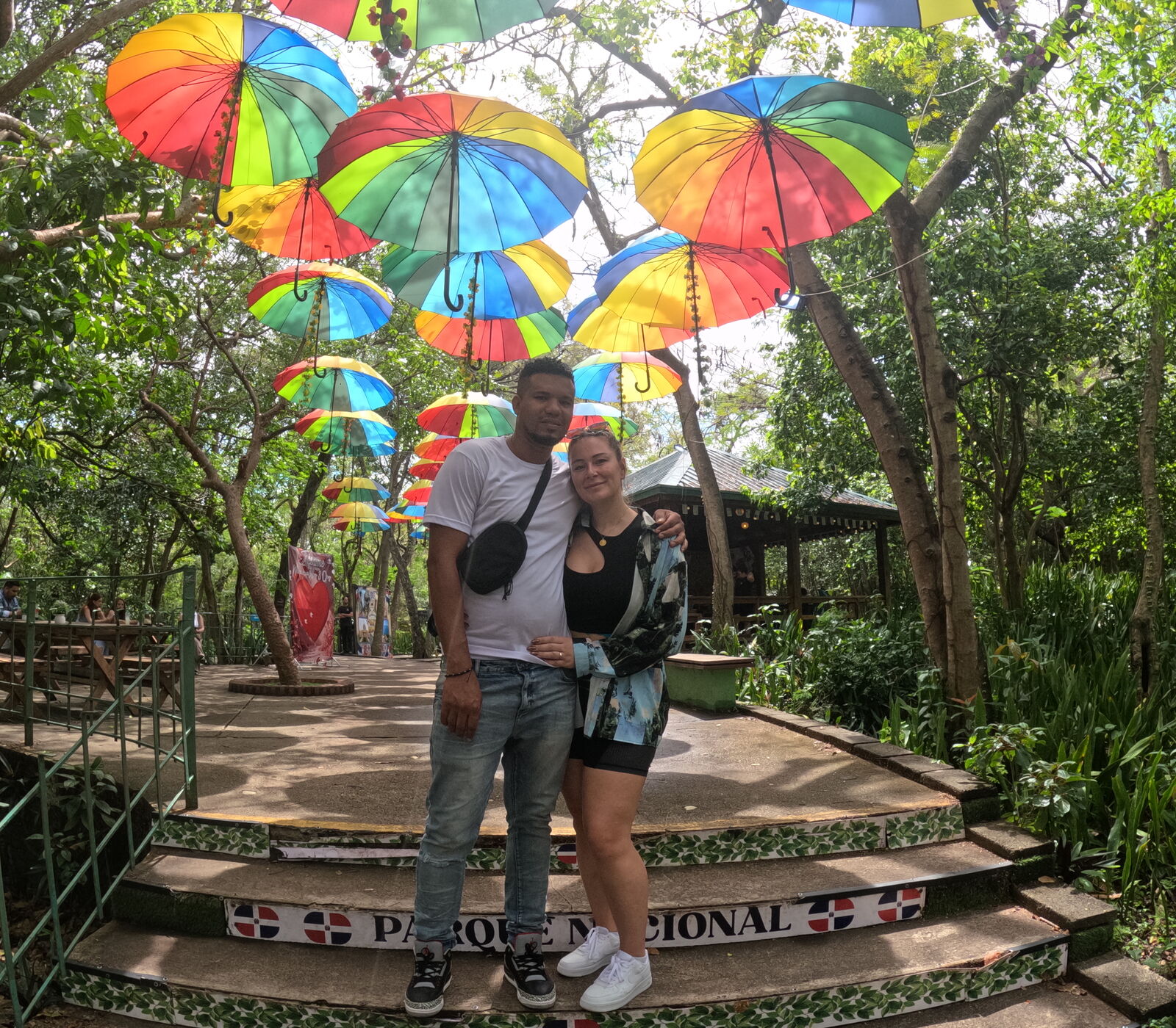 Yohan and Beaudine under beach umbrellas